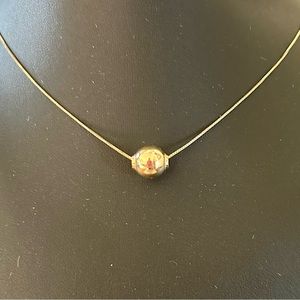 Floating gold ball necklace